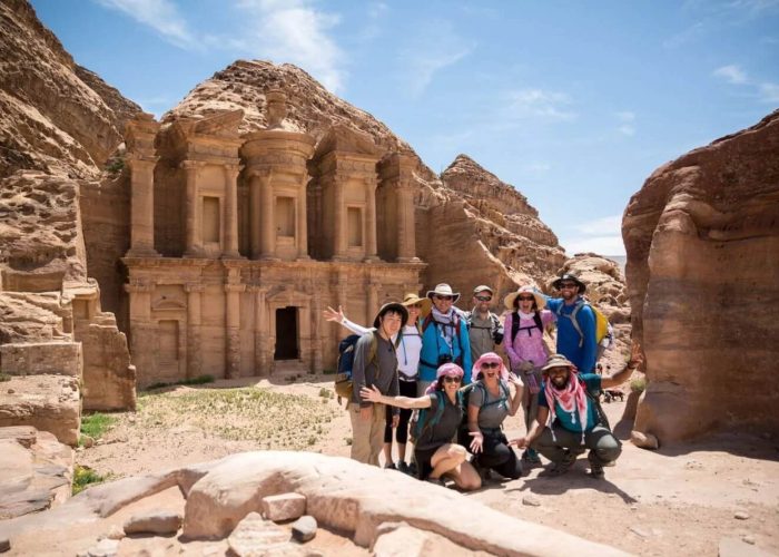 a-wonderful-photo-of-a-group-of-visitors-in-front-of-the-temple-of-petra
